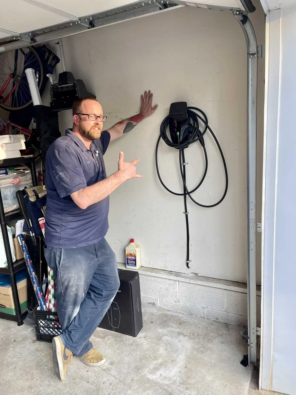 Tesla Wall Connector EV charger mounted and wired in a home garage